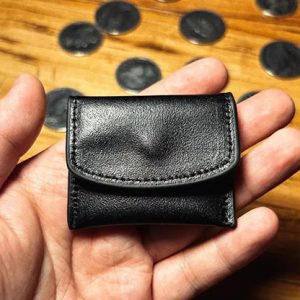 The Cowhide Coin Wallet (Black) by Bacon Magic – Trick
